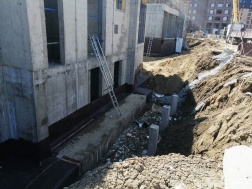 Многоэтажный жилой дом № 802 по г/п. Устройство гидроизоляции цоколя (600 м²)