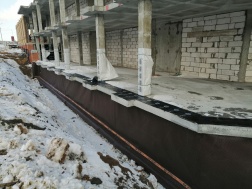 Многоэтажный жилой дом по адресу: Каспийская, 1. Устройство гидроизоляции цоколя (501 м²)